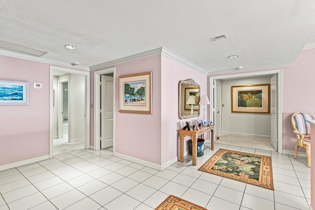 hall with crown molding, light tile patterned flooring, and baseboards