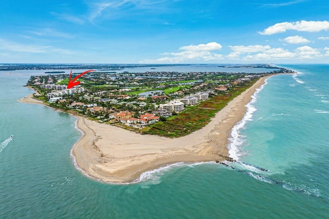 drone / aerial view with a beach view and a water view