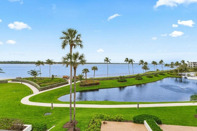 surrounding community featuring a yard and a water view