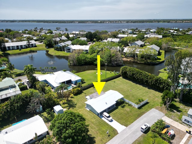 aerial view with a residential view and a water view