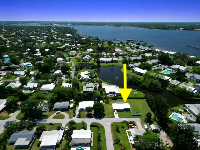 bird's eye view with a residential view and a water view