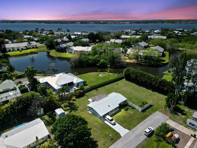 bird's eye view featuring a residential view and a water view