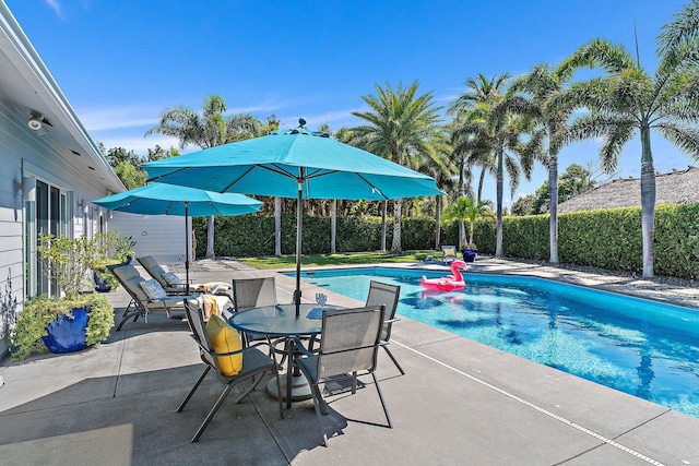 view of pool featuring a patio area and a fenced in pool