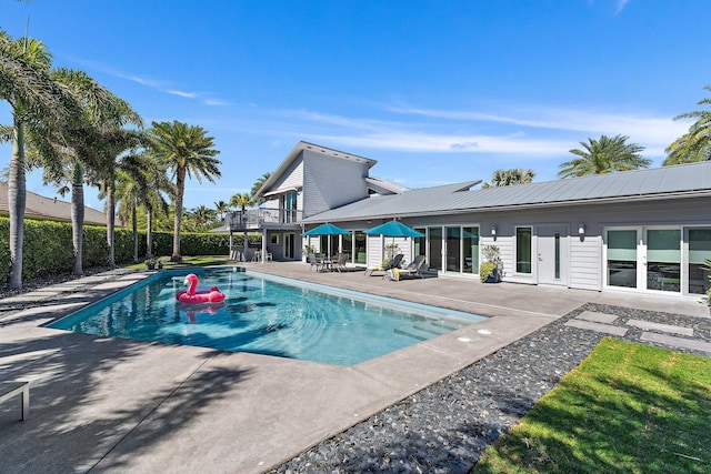 view of pool featuring a patio area, a fenced in pool, and fence