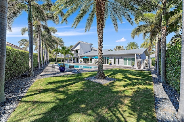 view of yard with a patio area, an outdoor pool, and a fenced backyard