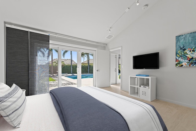 bedroom with visible vents, high vaulted ceiling, rail lighting, access to outside, and light wood-type flooring