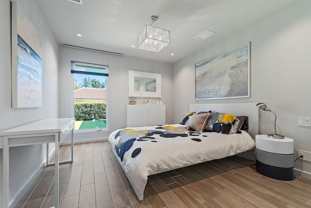 bedroom featuring recessed lighting, baseboards, and wood tiled floor