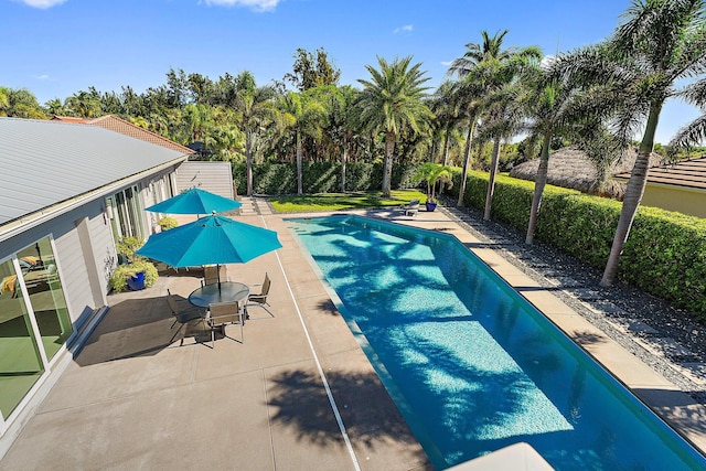 view of pool featuring a fenced in pool and a patio