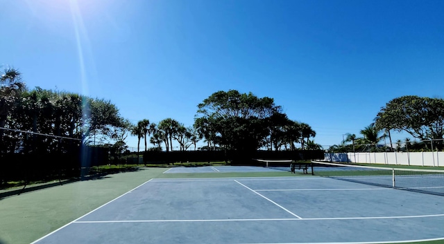 view of sport court with fence