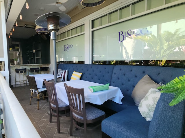 view of patio / terrace with outdoor dining area and a ceiling fan