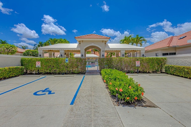 exterior space with fence and uncovered parking