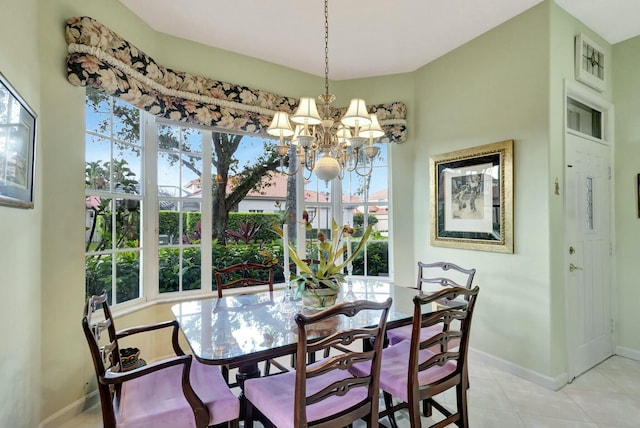 dining room featuring light tile patterned floors, an inviting chandelier, and baseboards