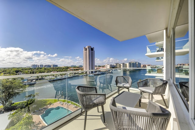 balcony with a city view and a water view