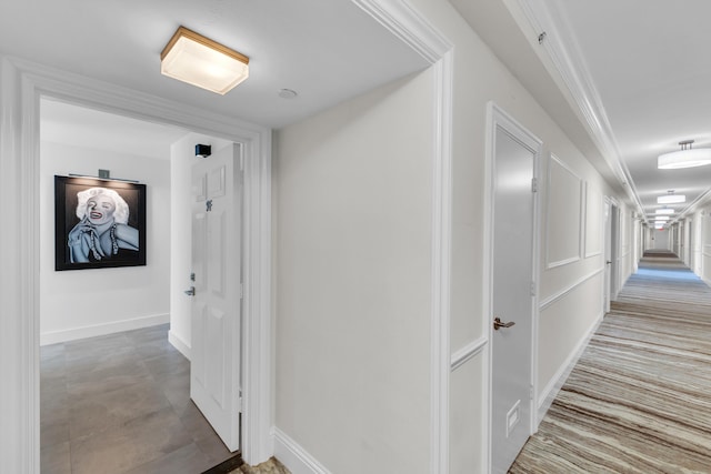 hallway featuring baseboards