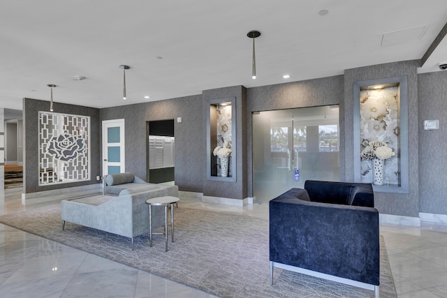 living room featuring recessed lighting, marble finish floor, wallpapered walls, and baseboards