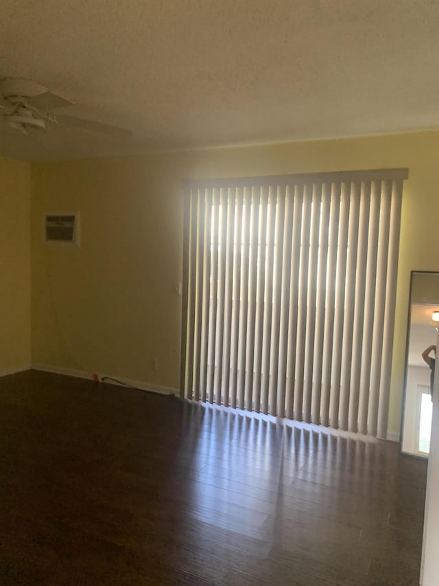 unfurnished room with wood finished floors