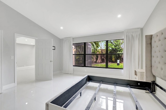 interior space featuring recessed lighting, baseboards, and lofted ceiling