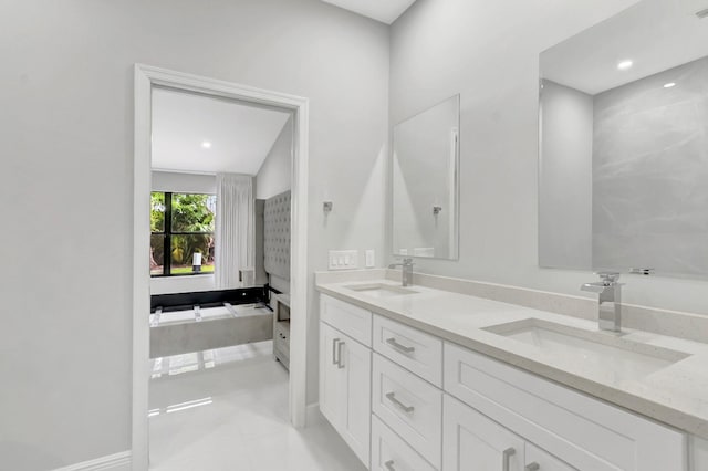 bathroom featuring double vanity and a sink