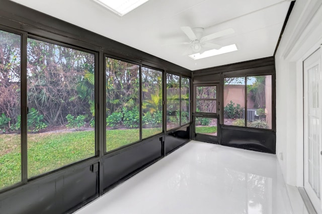 unfurnished sunroom featuring ceiling fan