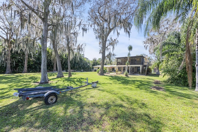 view of yard featuring a sunroom