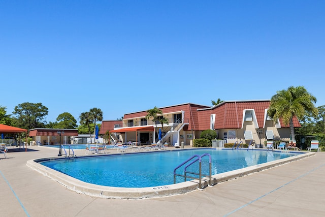 community pool featuring a patio area