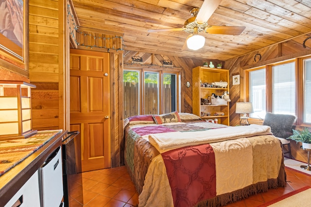 bedroom with wooden walls, wood ceiling, and tile patterned flooring