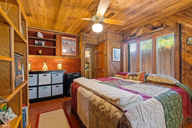 bedroom featuring tile patterned floors, wooden walls, wooden ceiling, and a ceiling fan