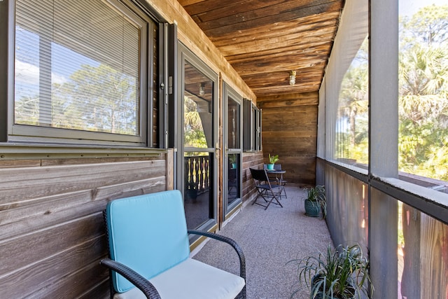 unfurnished sunroom featuring wooden ceiling