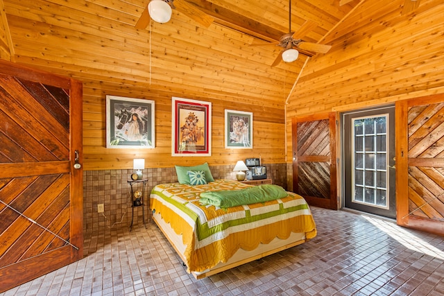 unfurnished bedroom featuring wood walls and high vaulted ceiling