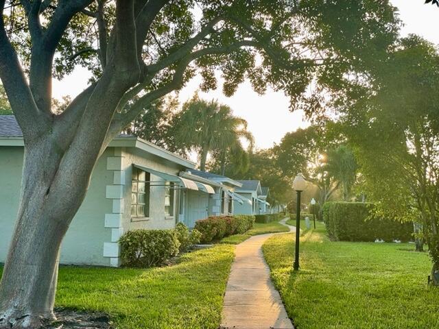 view of property's community with a lawn