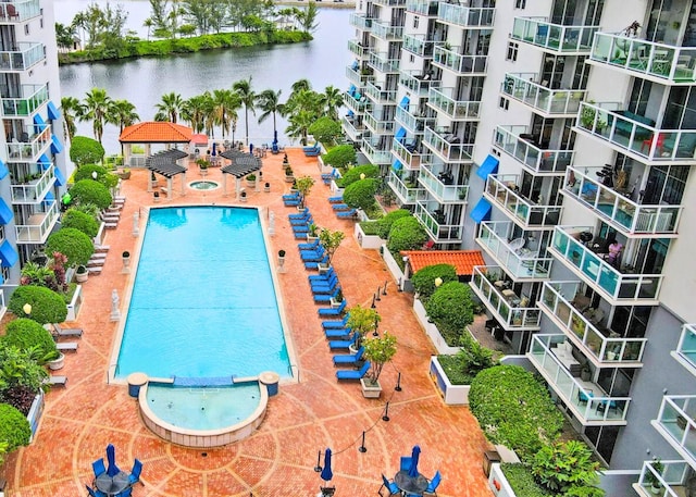 view of pool with a water view