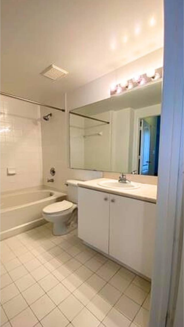 bathroom featuring vanity, visible vents, bathtub / shower combination, tile patterned floors, and toilet