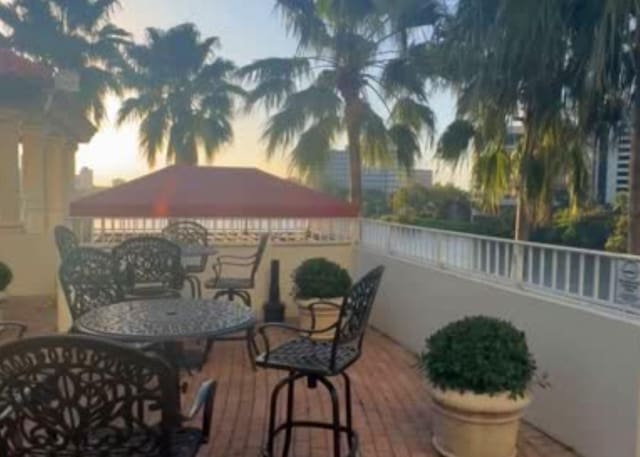 view of patio with a gazebo and outdoor dining space