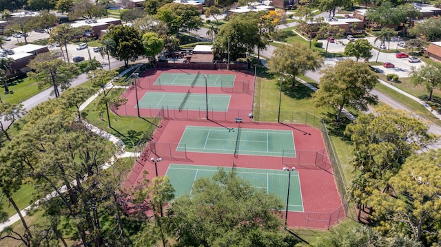 view of tennis court featuring fence