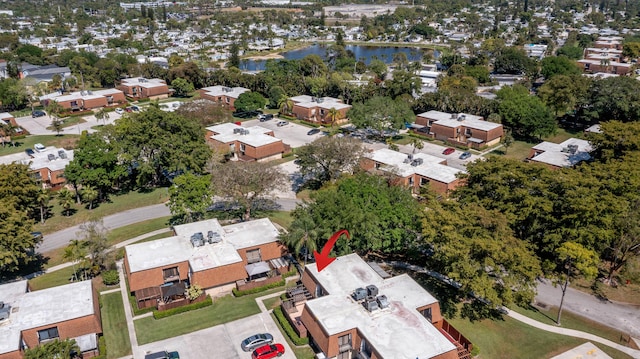 bird's eye view with a residential view and a water view