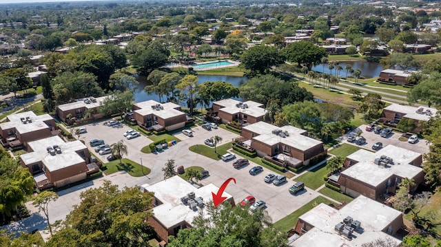 bird's eye view with a residential view and a water view