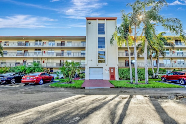 view of property with uncovered parking