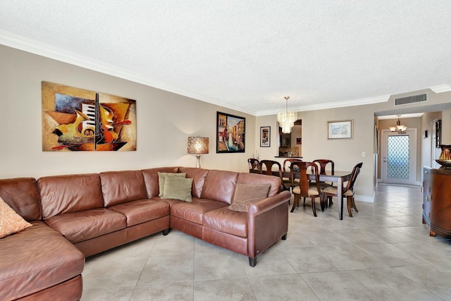 living area featuring visible vents, a textured ceiling, crown molding, and an inviting chandelier