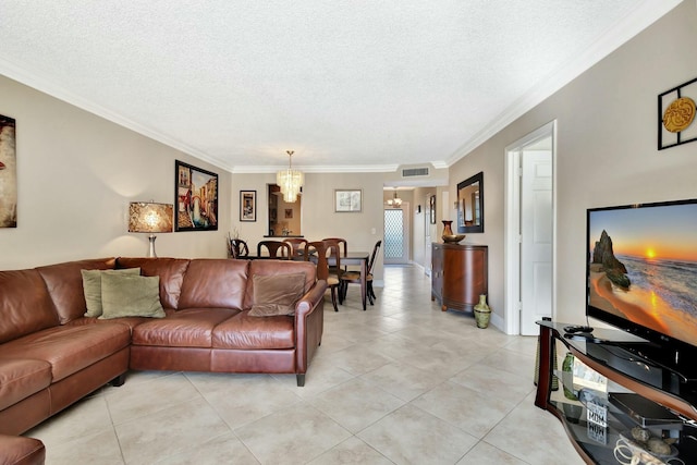 living room featuring light tile patterned floors, a notable chandelier, a textured ceiling, and crown molding