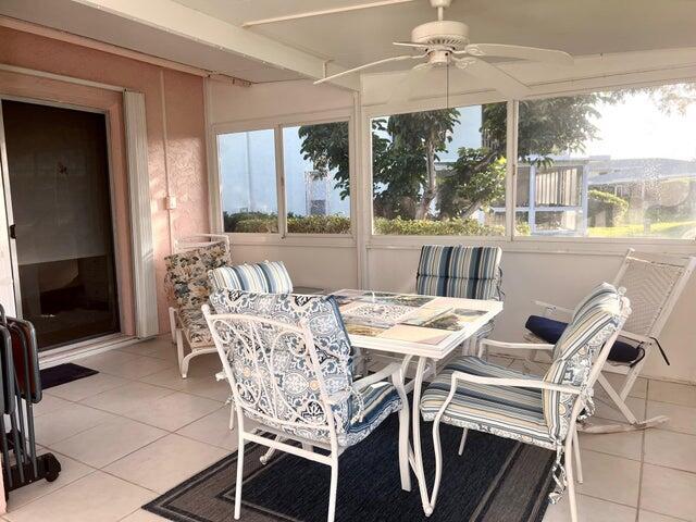 sunroom / solarium with ceiling fan