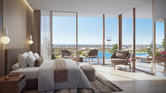 bedroom featuring wood finished floors and expansive windows