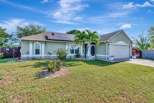 ranch-style home with fence, a garage, roof mounted solar panels, and stucco siding