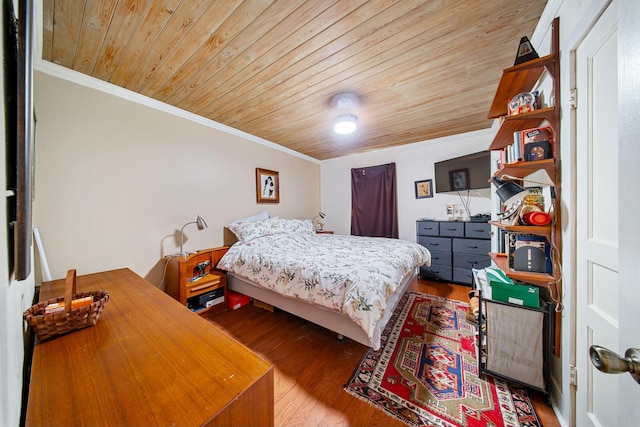 bedroom featuring crown molding, wood finished floors, and wooden ceiling