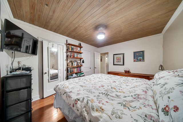 bedroom featuring wood-type flooring, wood ceiling, and ornamental molding
