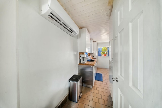 hall featuring wooden ceiling, tile patterned flooring, and a wall unit AC