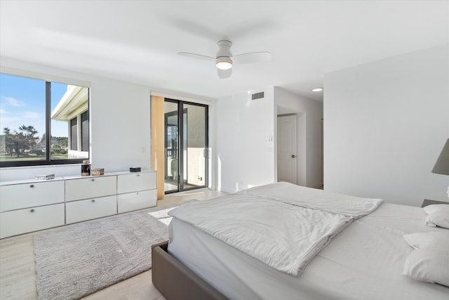 bedroom featuring access to exterior, visible vents, light wood finished floors, and a ceiling fan