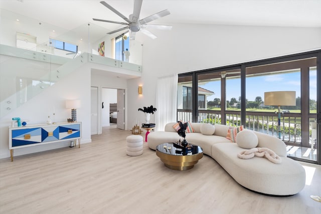 living room featuring a ceiling fan and wood finished floors