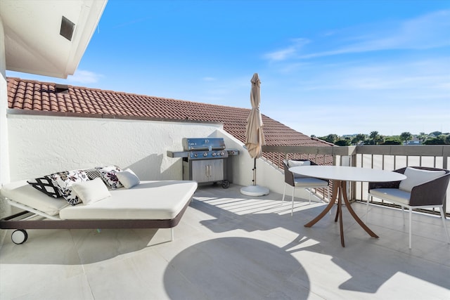 view of patio with grilling area and outdoor dining area