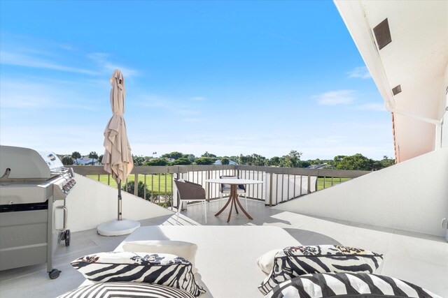 view of patio with a balcony