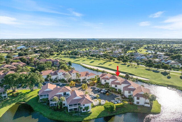 drone / aerial view with a residential view and a water view